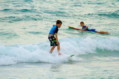Kids have fun learning to surf Barbados